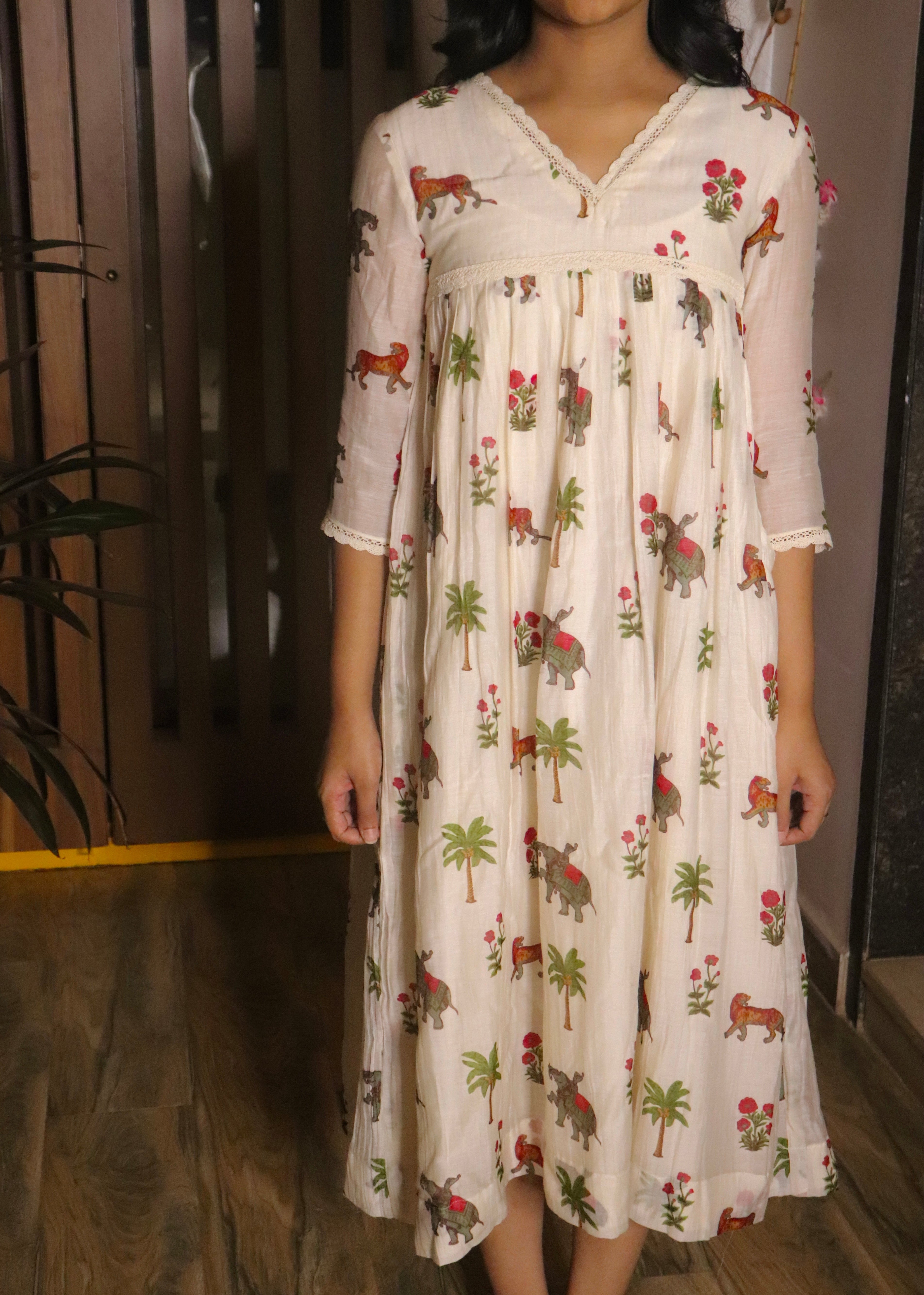 Woman wearing a floral dress with a wooden background